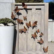 Envol de papillons métal posé en extérieur