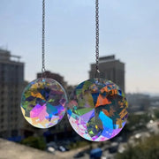 Deux disques attrape-soleil ronds aux reflets multicolores